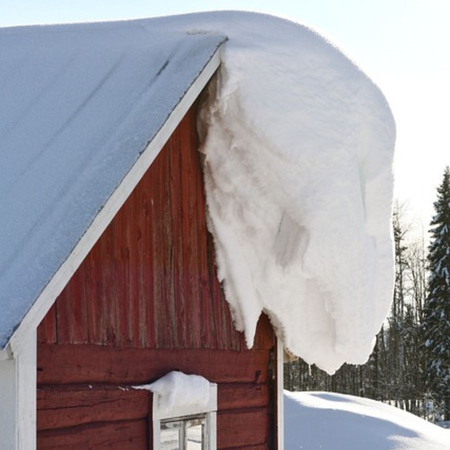 snow hanging off a roof